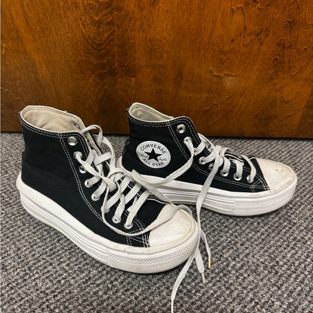 Black and white Converse trainers